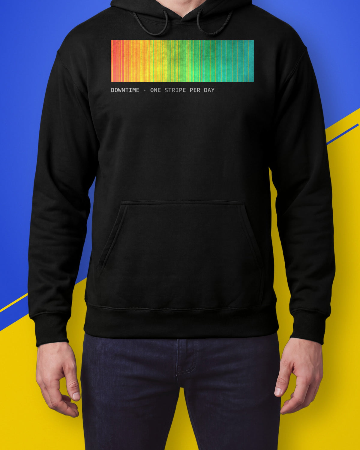 Model wearing a black hoodie with a band of red to cyan stripes and the label DOWNTIME ONE STRIPE PER DAY