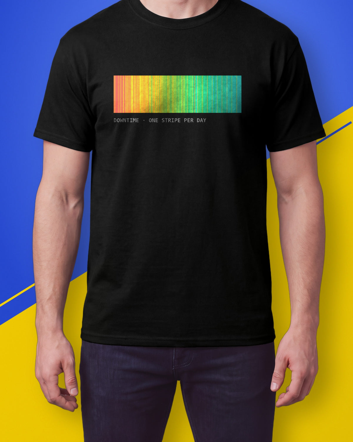 Model wearing a black T-shirt with a band of red to cyan stripes and the label DOWNTIME ONE STRIPE PER DAY